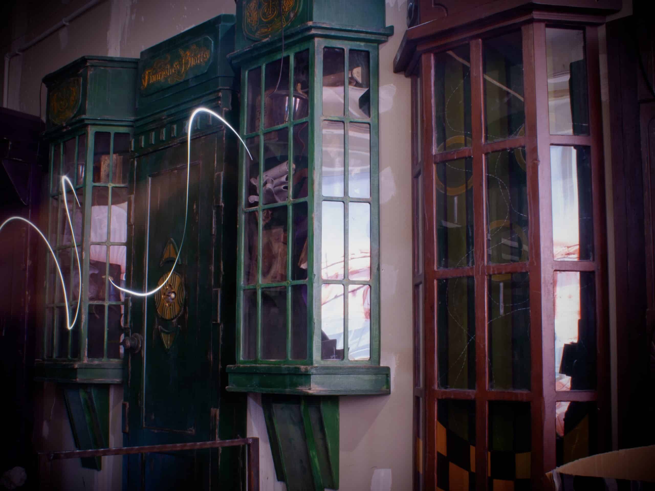 Vintage escape room cabinet with green and brown wooden puzzle panels in Bern.